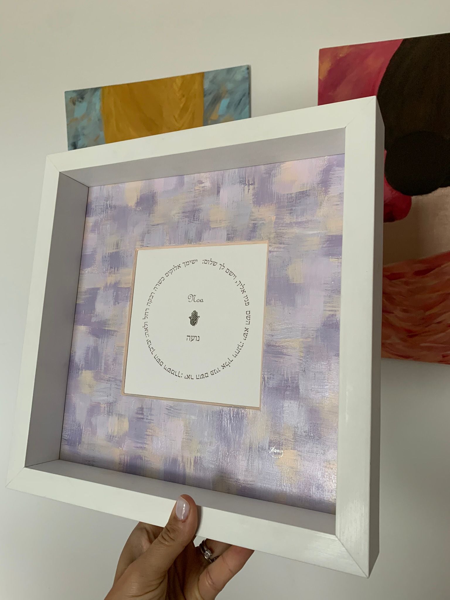Close-up of Birkat HaYeladim purple and white children's blessing, hand-painted Hebrew prayer art in white frame