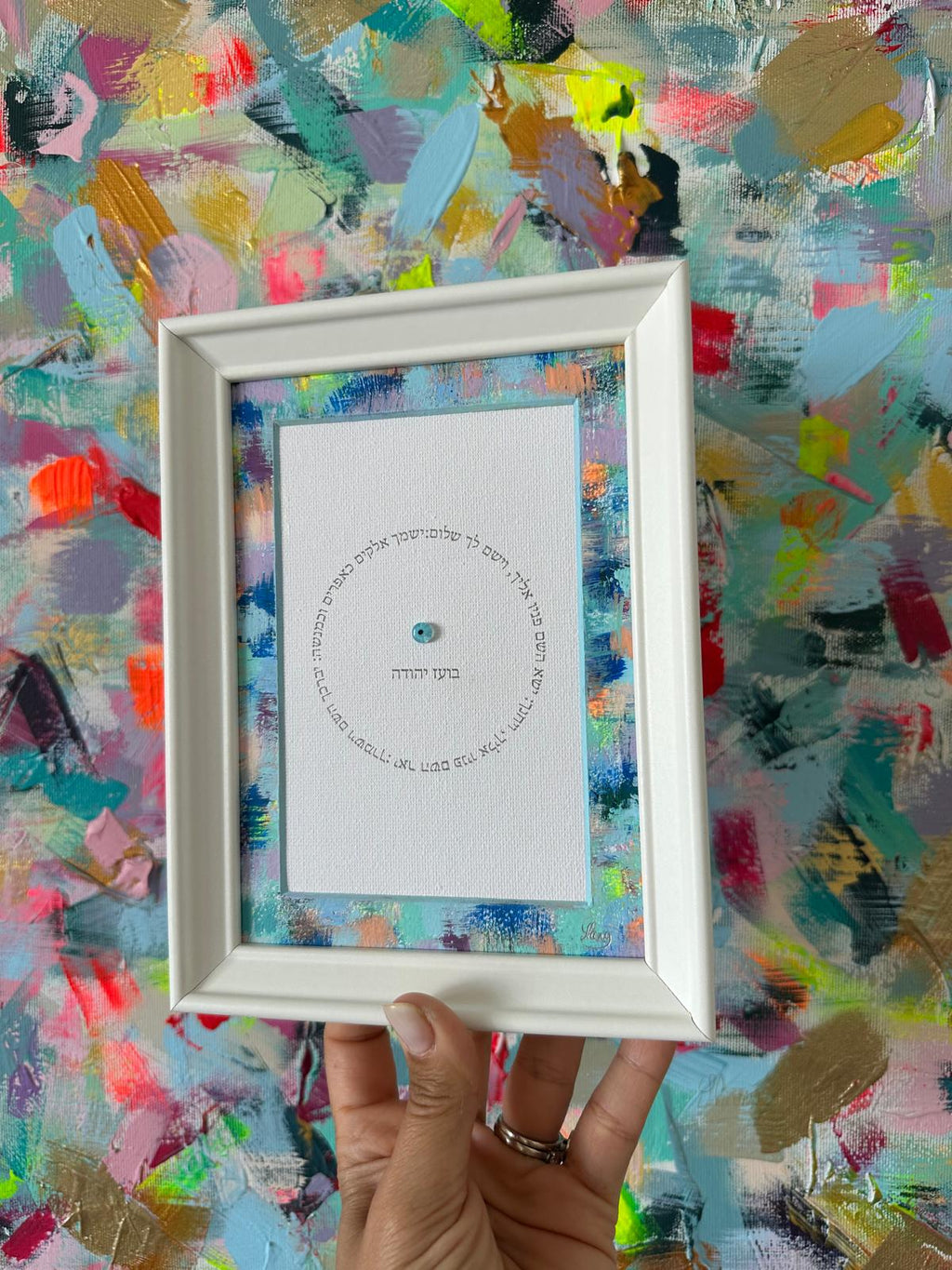 Birkat HaYeladim — The Mini held in hand showing frame and artwork detail, hand-painted Hebrew children's blessing